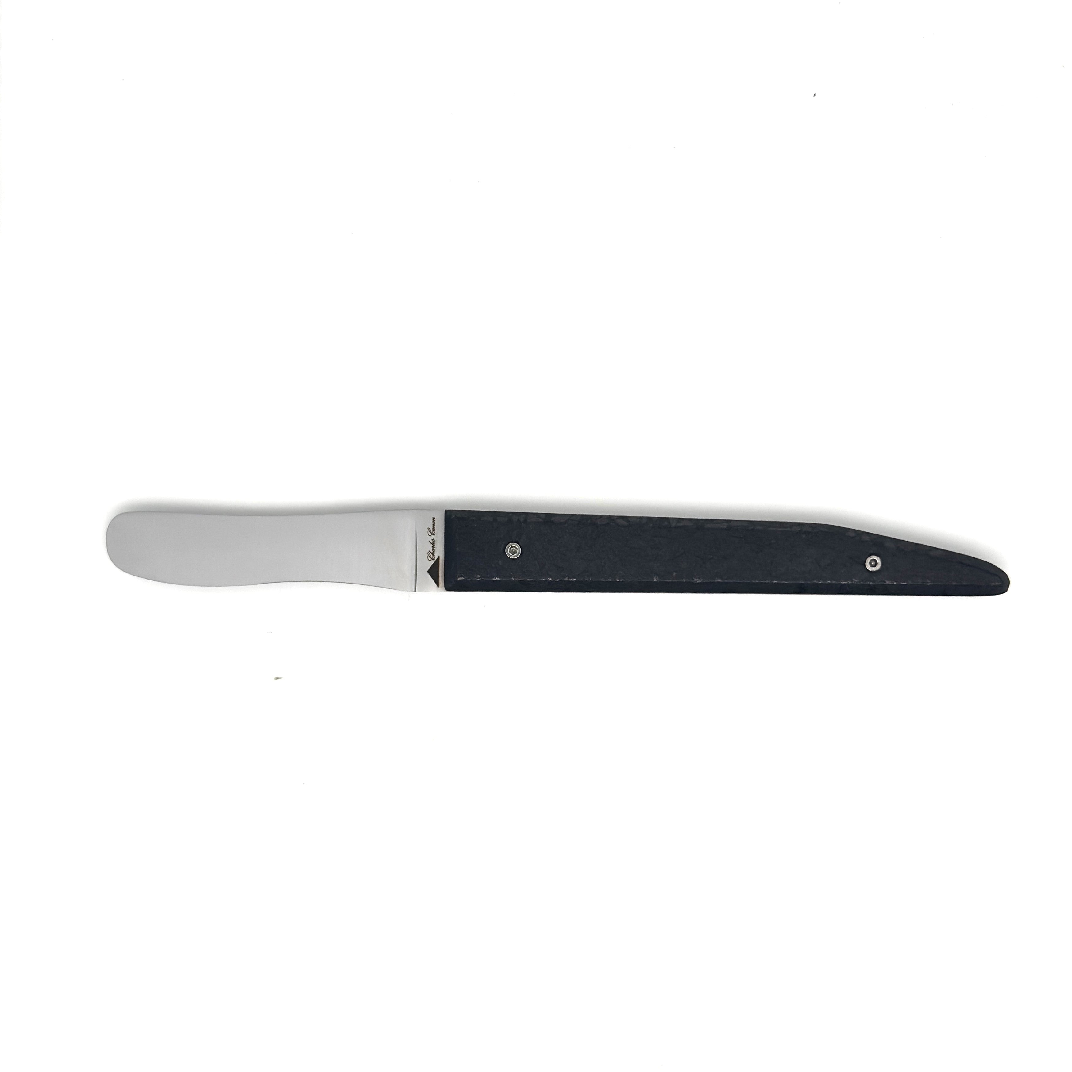 Butter knife with its raw charcoal handle
