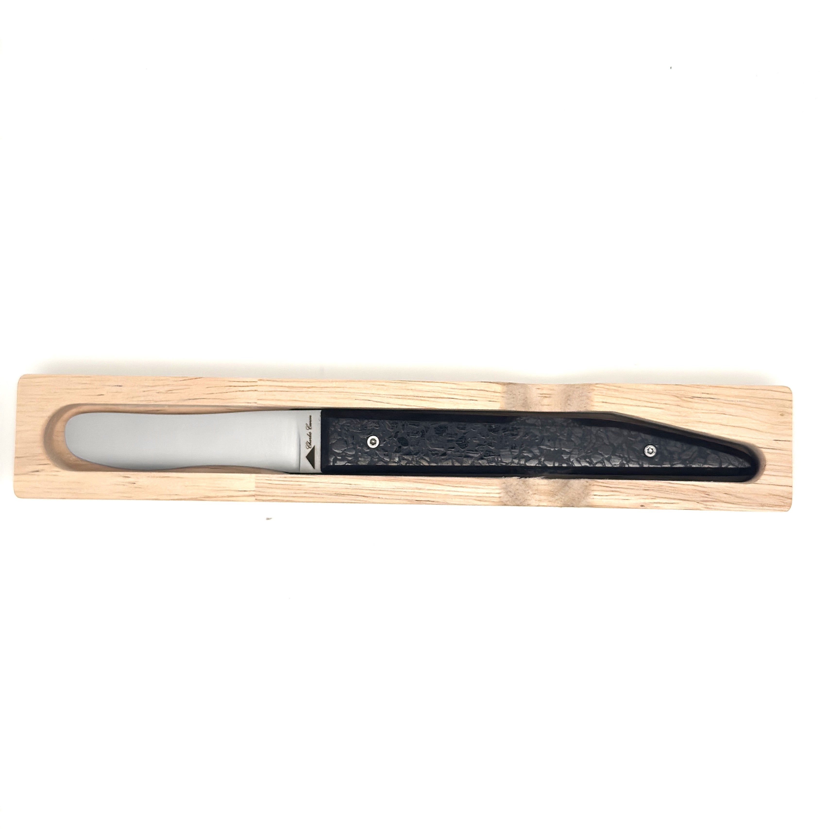 Butter knife with its shiny charcoal handle
