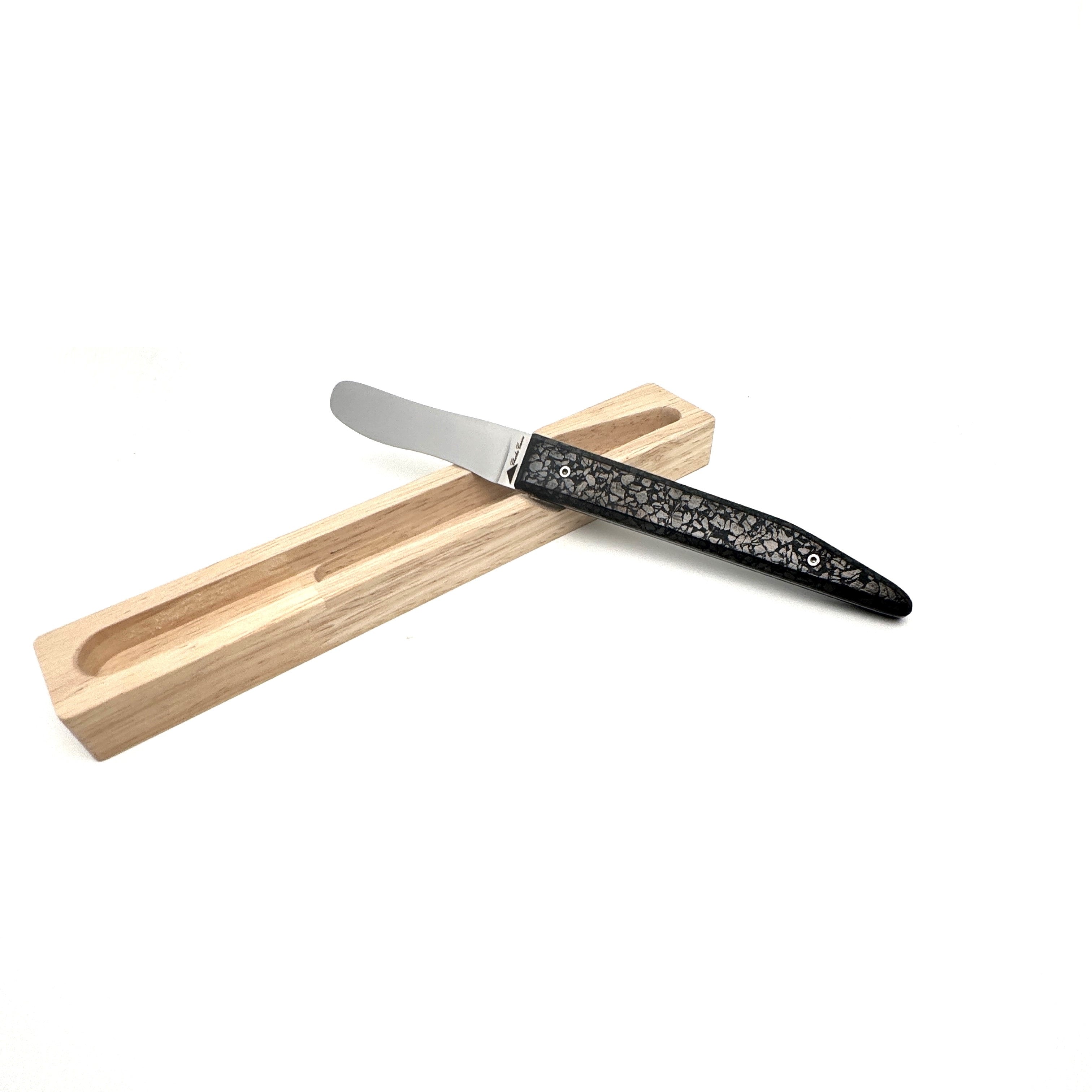 Butter knife with its shiny charcoal handle