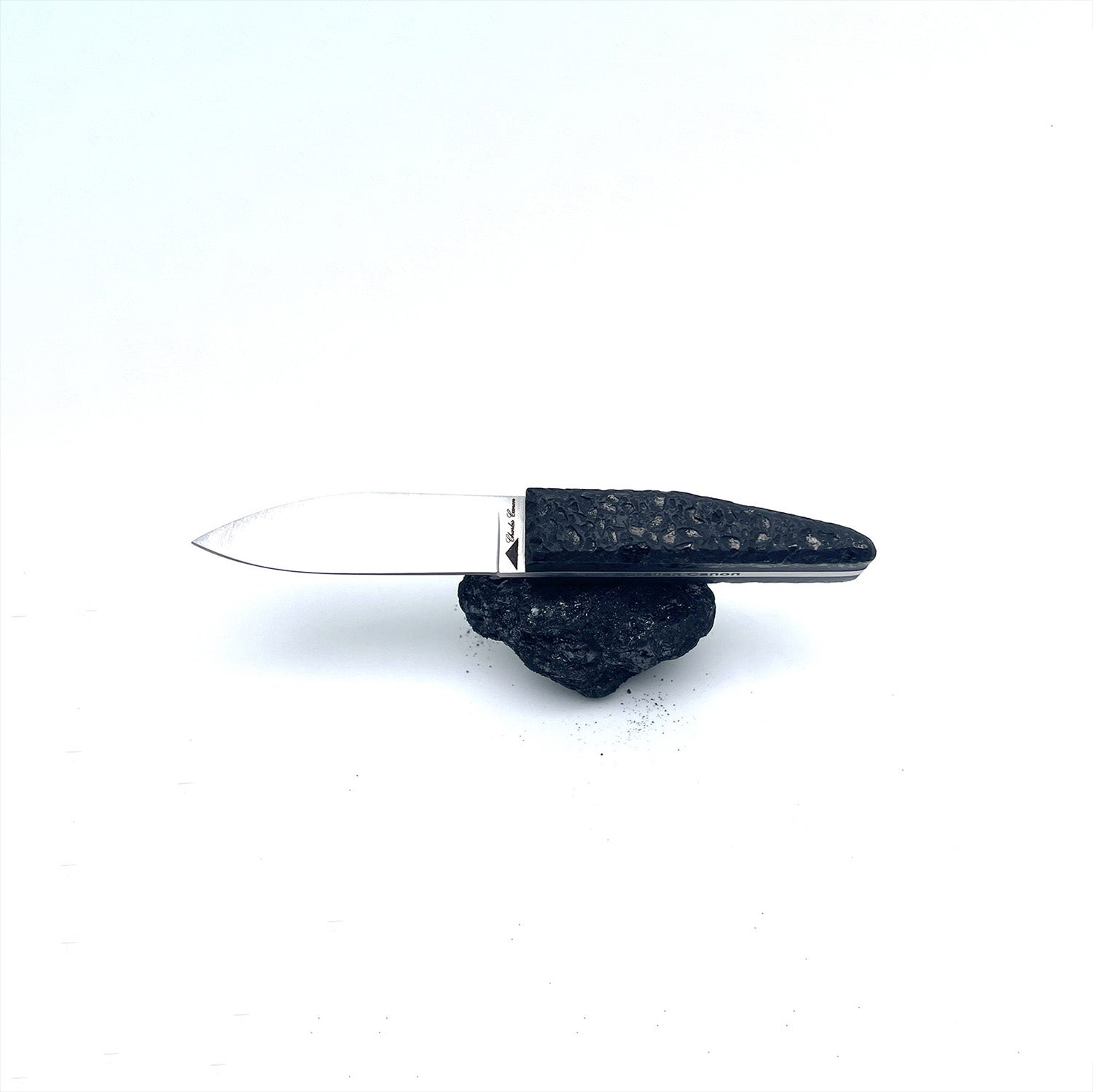 Small cutter with a raw charcoal handle