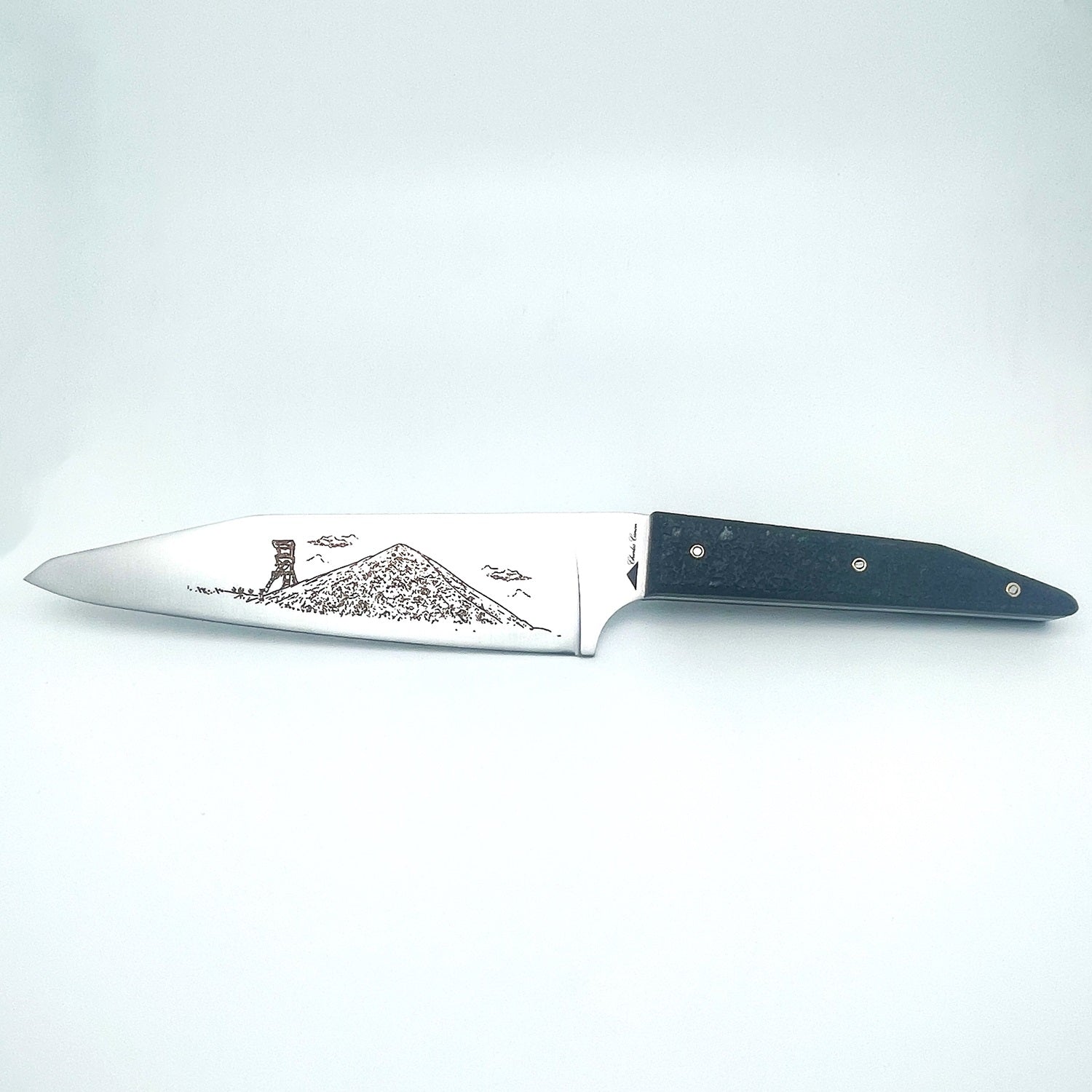 Chef's knife with raw charcoal handle