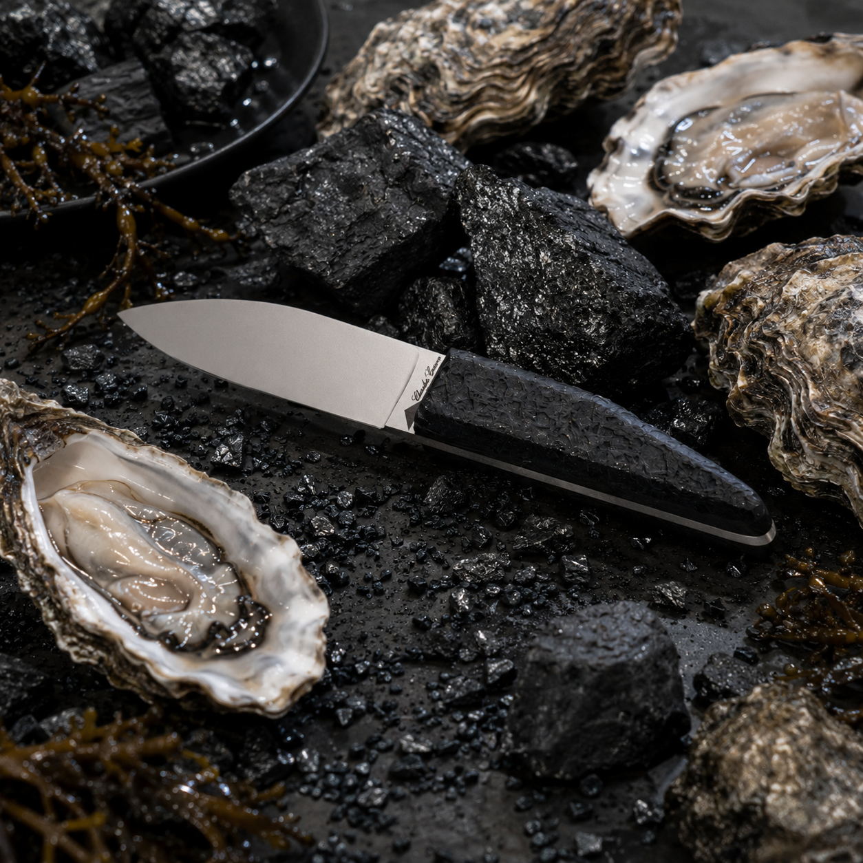 Small oyster knife with a raw charcoal handle