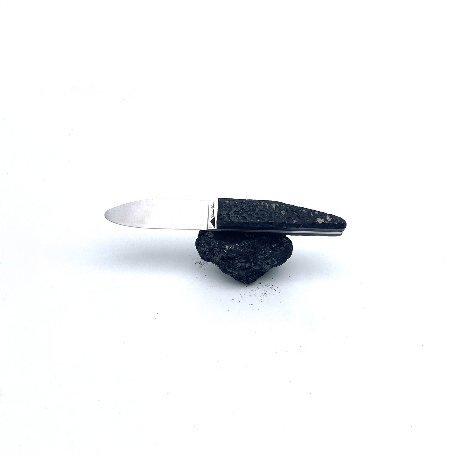 Children's knife with a raw charcoal handle