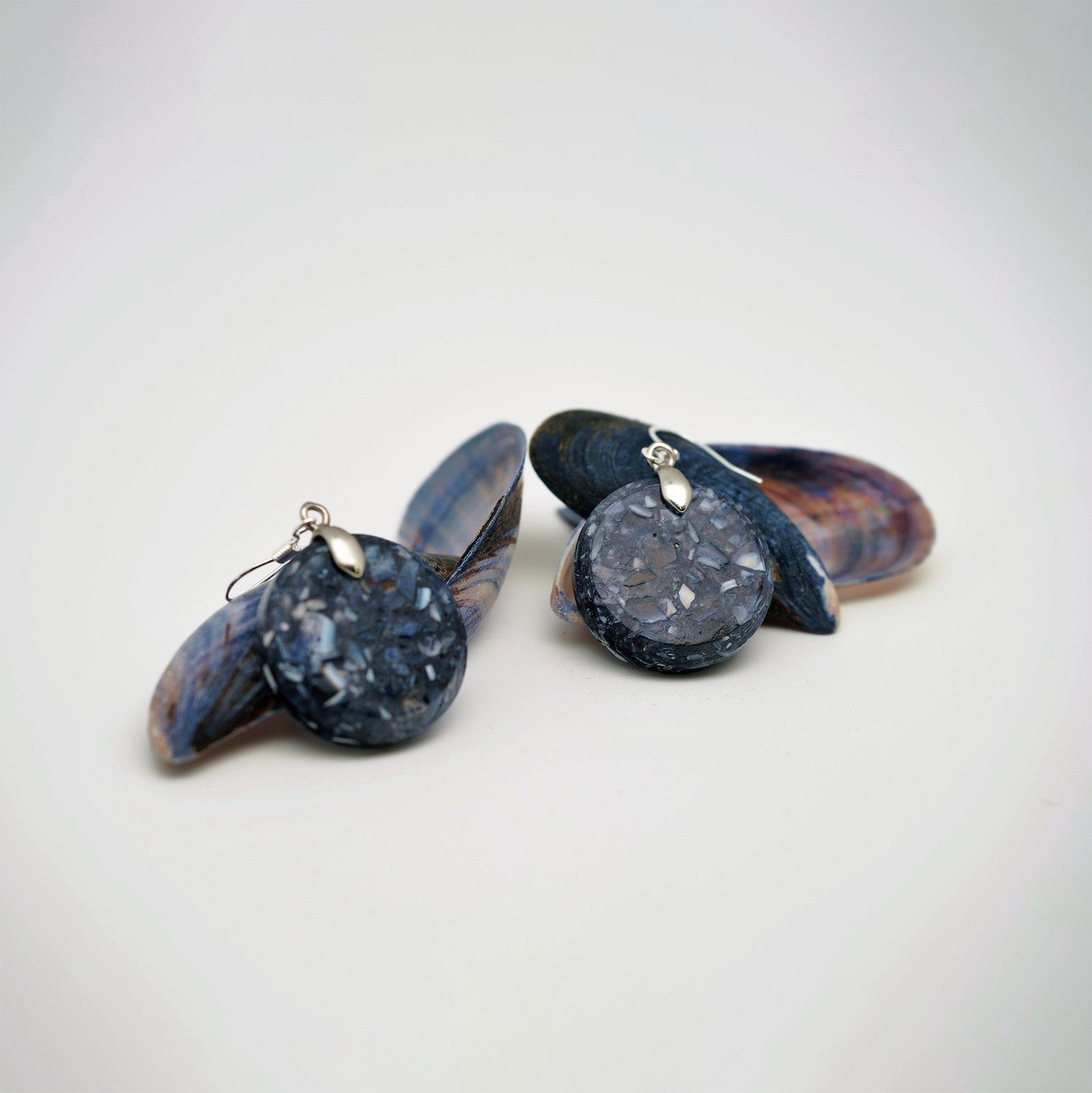 Round earrings made from recycled mussel shells