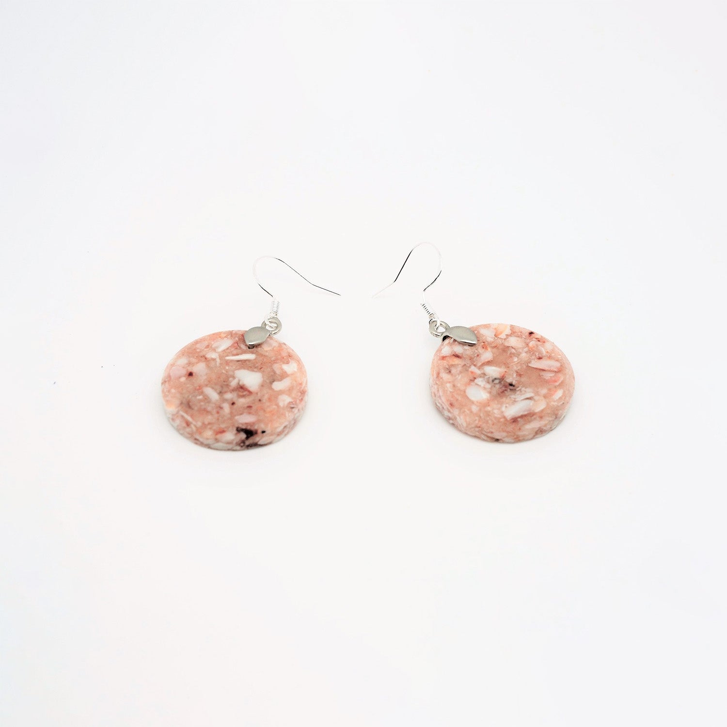 Round earrings made from recycled scallop shells