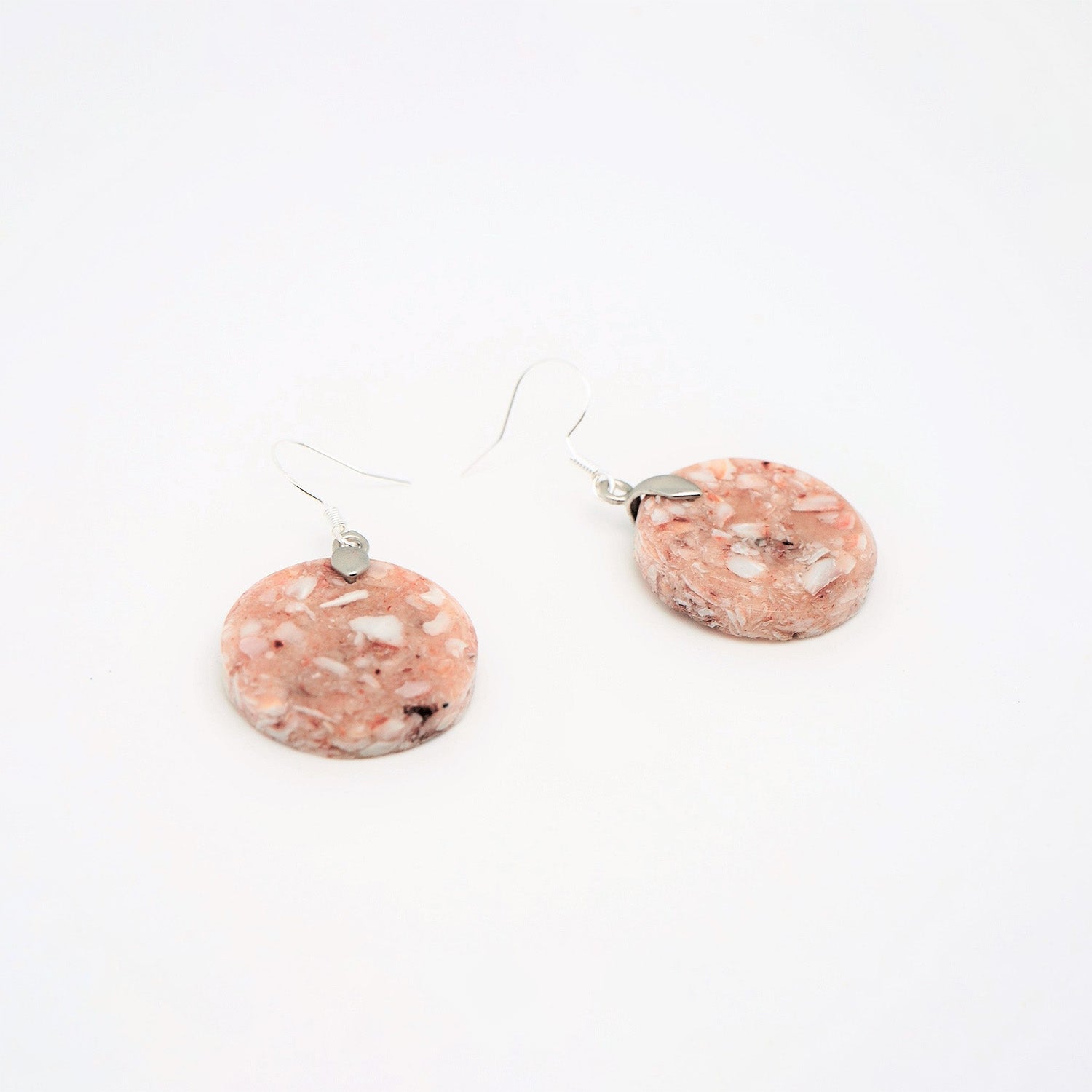 Round earrings made from recycled scallop shells